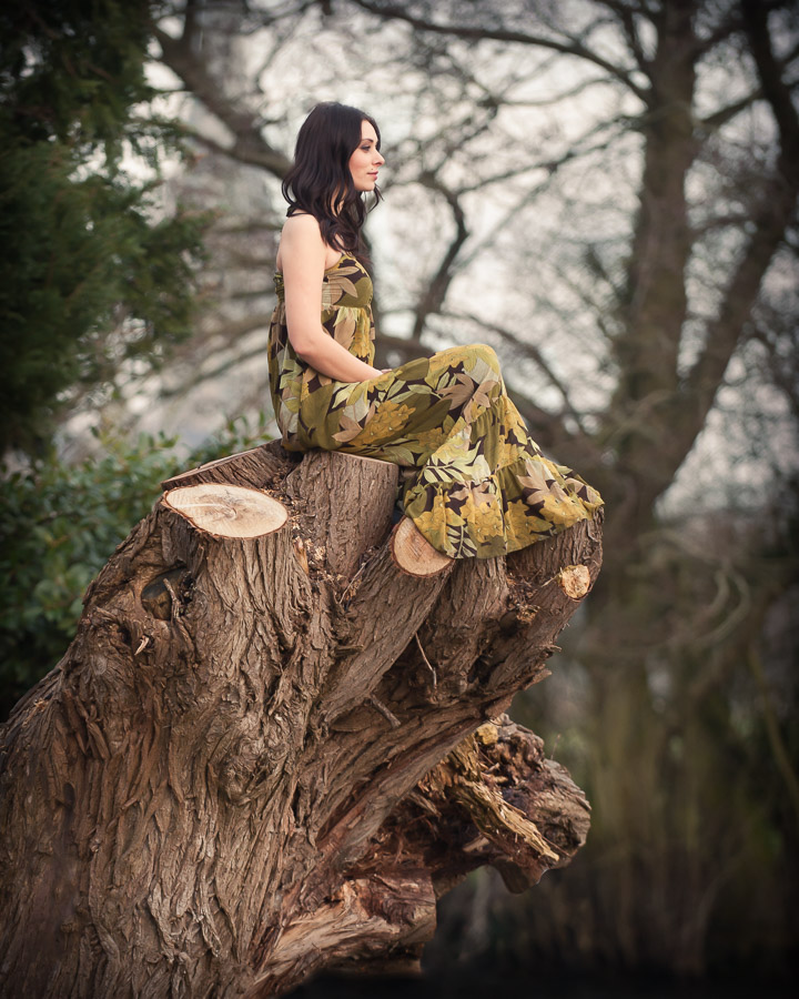 Girl on the tree stump. Near Old Mill